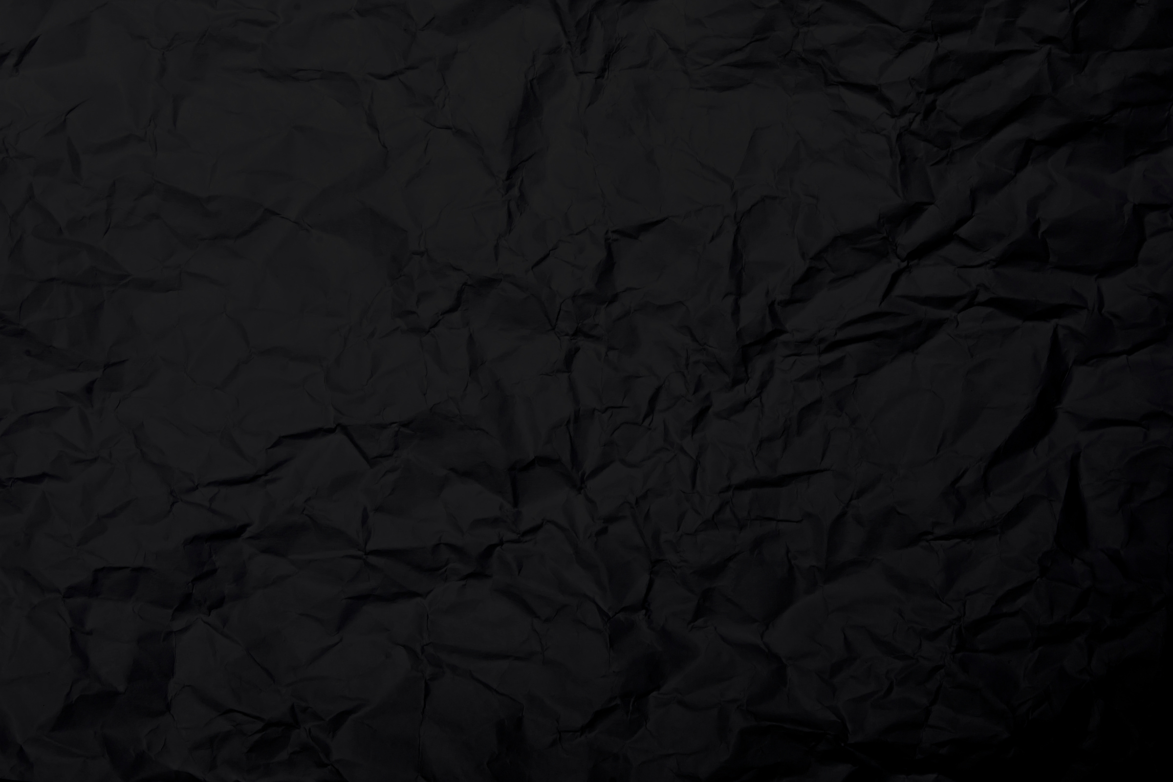 Black Crumpled Paper Texture Background